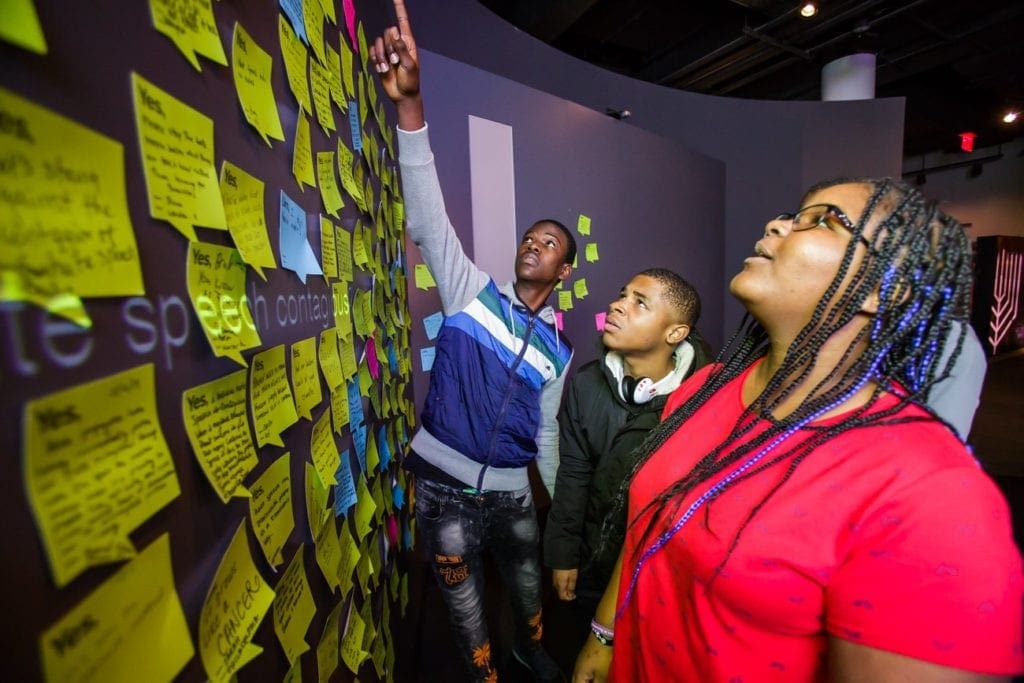 9th Graders reading post-it notes at NMAJH