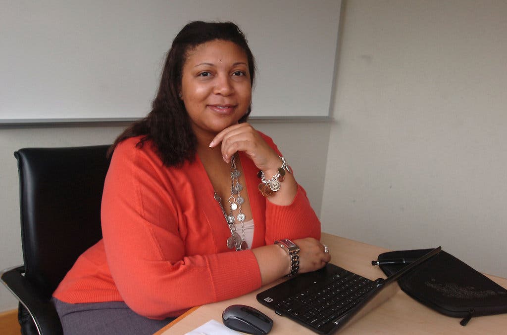 In Photo: Portrait of professional woman smiling