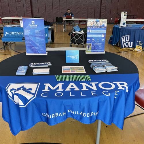 Tables in KCAPA gym for college fair