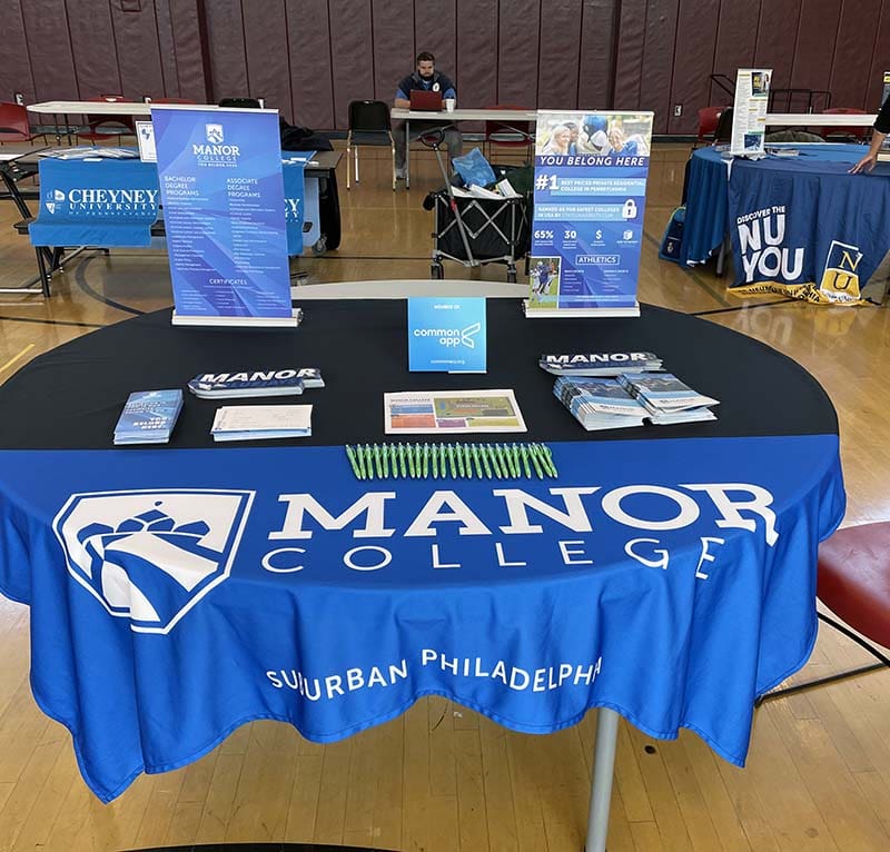 Tables in KCAPA gym for college fair