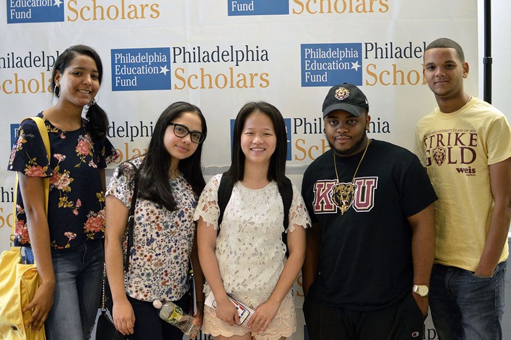 Group of 5 high school students in front of a Philadelphia Education Fund backdrop.